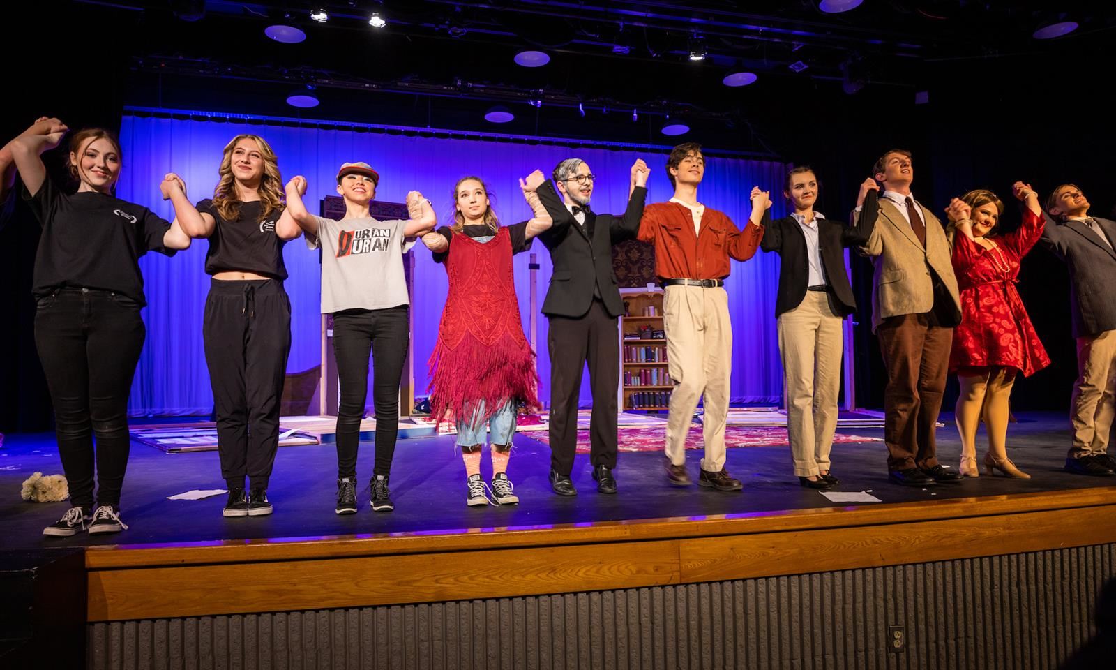 Student actors bow onstage